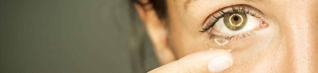 girl inserts contacts