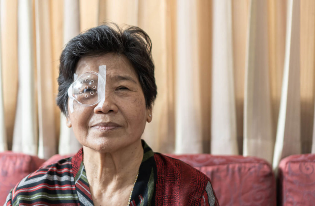 An elderly woman with diabetes had her eyes with protective cover after cataract surgery