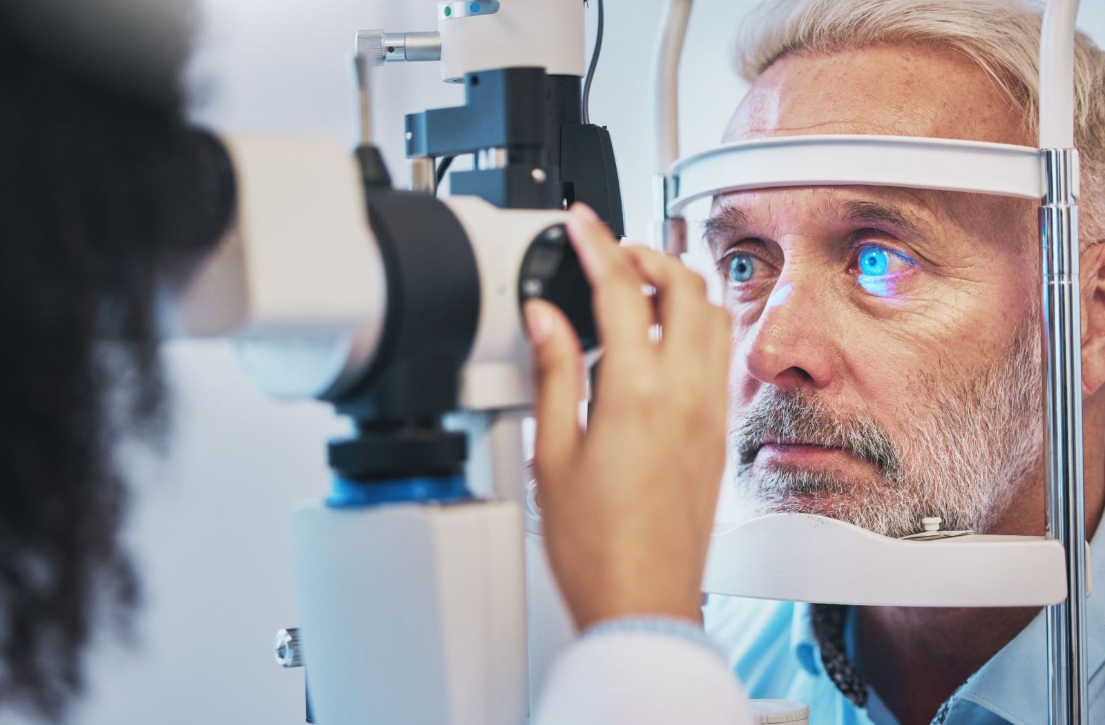 Mature gentleman getting his eyes examined.
