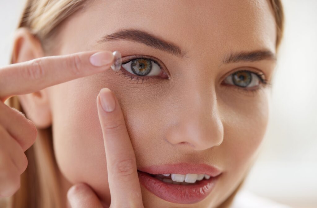 A contact lens wearer putting in their contact lenses