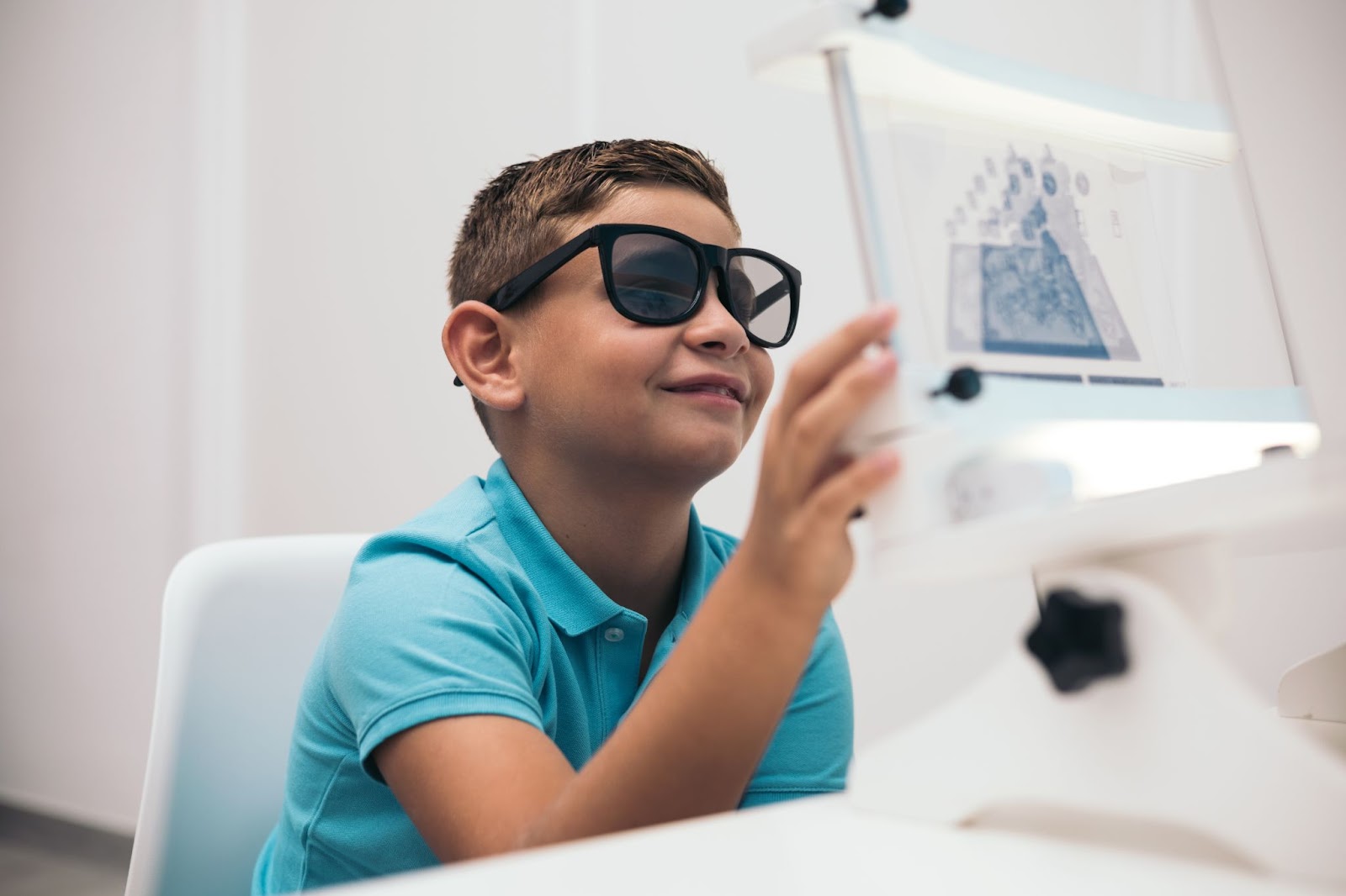 A child undergoes a convergence-divergence test using vectograms with polarized lenses.vision therapy.