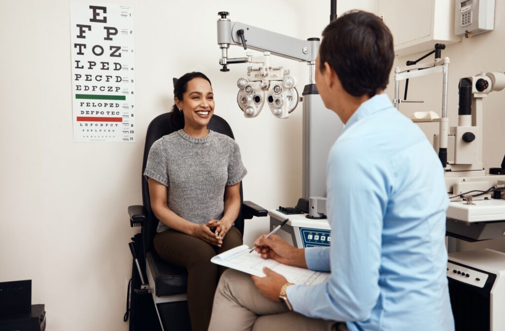 A patient discusses their visual concerns with their optometrist during a routine eye exam.
